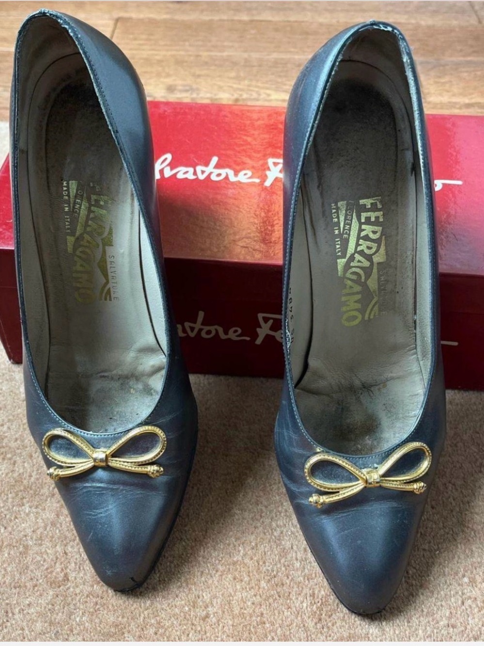 Salvatore Ferragamo Black Leather Bow Pumps with Gold Hardware